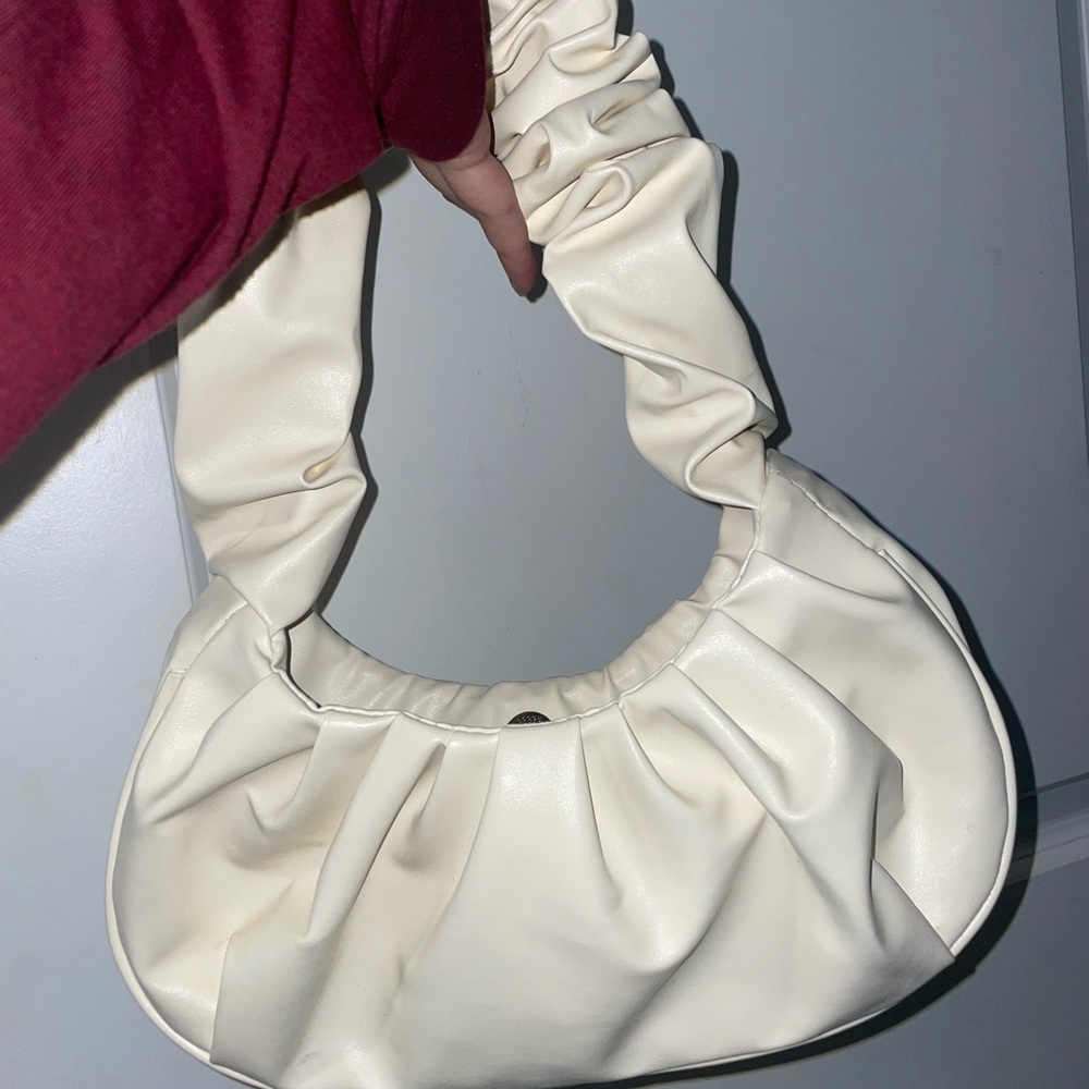 Cream colored ruffle purse